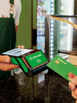 Manager receiving the payment, in a cafeteria