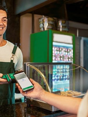 Manager receiving the payment, in a cafeteria