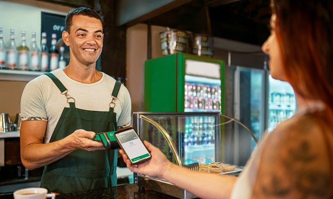 Manager receiving the payment, in a cafeteria